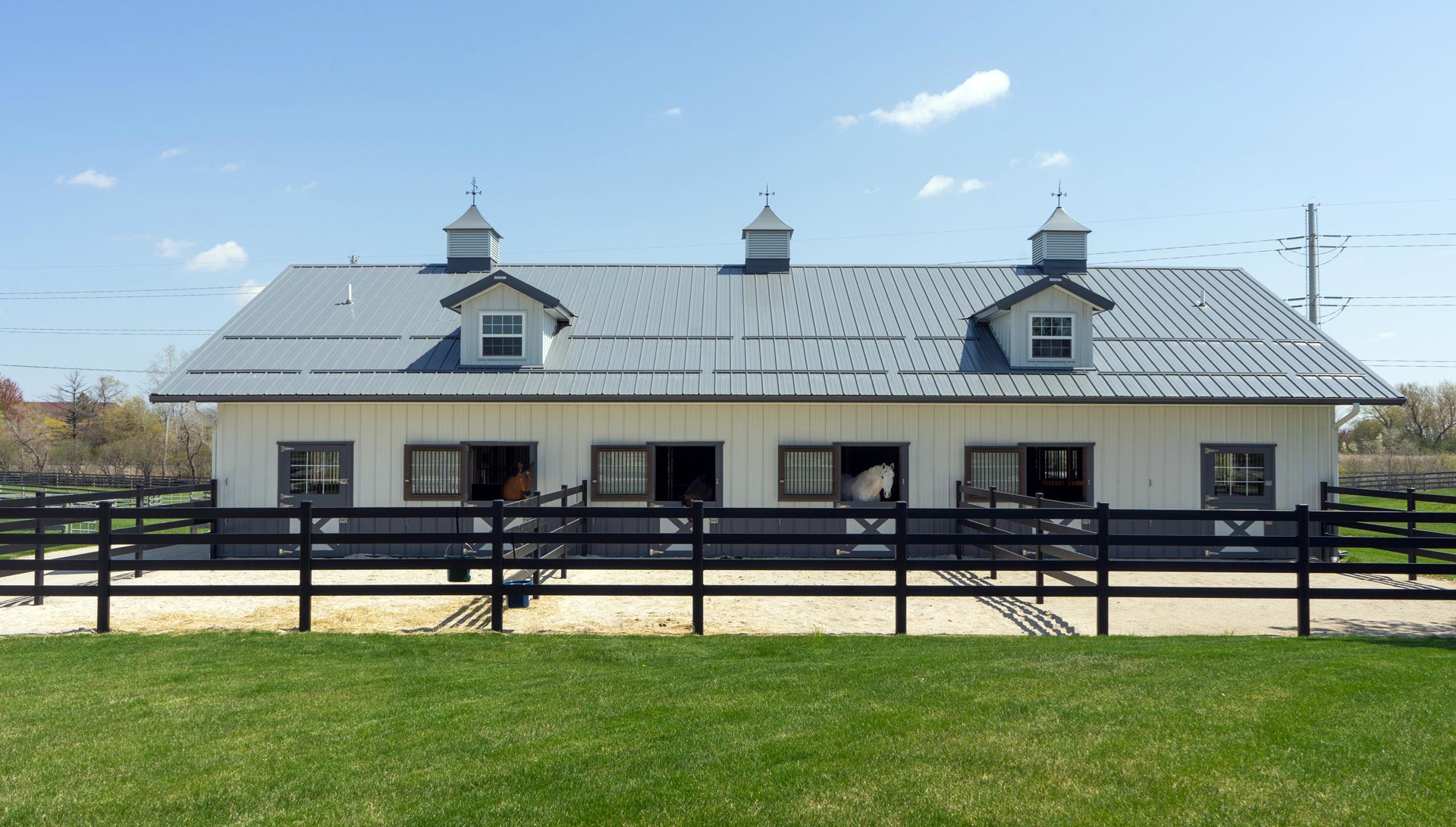 The Iverson Equine barn with paddocks directly next to it